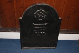 A cast iron fireback