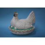 A Victorian giant Staffordshire pottery hen on basket egg tureen, 39cm length