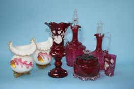 A collection of cranberry glass and a pair of decorative glass vases