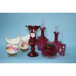 A collection of cranberry glass and a pair of decorative glass vases