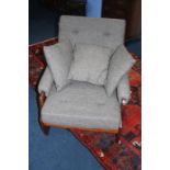 A teak framed armchair, with grey upholstery