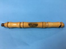 A Mauchline ware 'The Links Whitley Bay' slide whistle