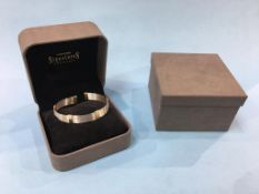 A David Morris ‘Afrika’ 18ct gold bangle, stamped 750, weight 14.9 gram (boxed)