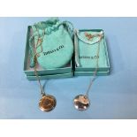 A Tiffany and Co, Elsa Peretti 925 silver pendant and a Tiffany and Co mirrored pendant (boxed) (2)