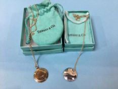 A Tiffany and Co, Elsa Peretti 925 silver pendant and a Tiffany and Co mirrored pendant (boxed) (2)