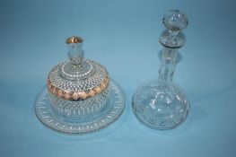 A Victorian glass cheese dish and cover with enamelled decoration and a decanter
