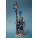 A Lladro Lamplighter figure