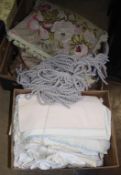 Two boxes of linen and fabrics