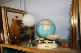 Shelf of assorted, including an oil lamp