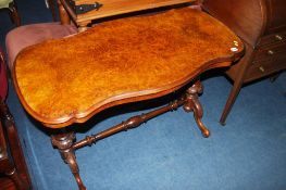 A Victorian walnut centre table with quarter top