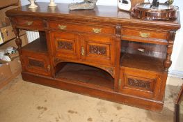 A large carved oak sideboard