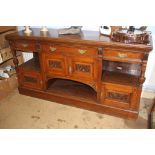 A large carved oak sideboard