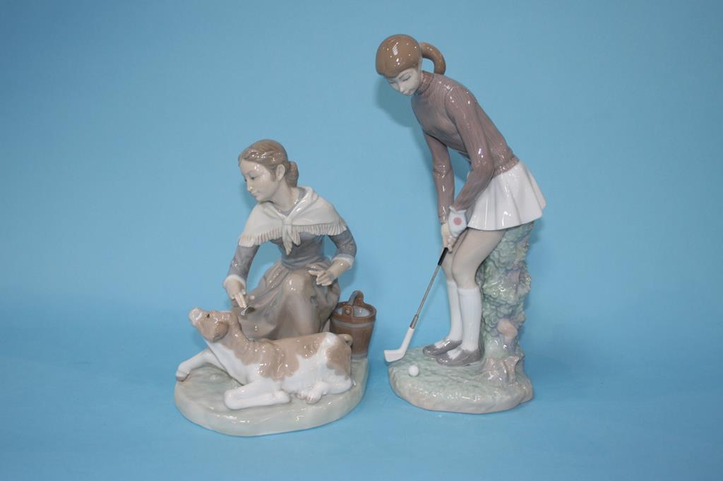 A Lladro group of a girl with a calf and a Lladro golfer (2)