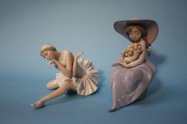 A Lladro figure of a girl holding flowers and a ballerina figure (2)