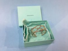 A Tiffany and Co ‘Knots Cuff’ bangle, stamped 925 (boxed)