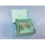 A Tiffany and Co ‘Knots Cuff’ bangle, stamped 925 (boxed)