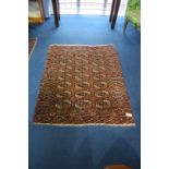 A Tekke Bokhara rug, with three rows of guls, sunburst main border and floral geometric skirting