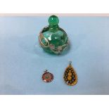 A scent bottle and two millefiori glass pendants