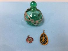 A scent bottle and two millefiori glass pendants