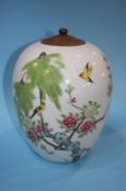 An Oriental vase decorated with exotic birds, 25cm height