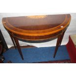 A reproduction mahogany Edwardian style half moon side table