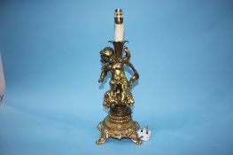 A gilt metal Cherub table lamp