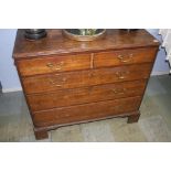 A 19th century oak chest of drawers, with two short and three long graduated drawers