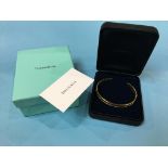 A Tiffany and Co. 18ct gold ‘Atlas Cuff’ bangle, stamped 750, dated 1995, weight 37.3 gram (boxed)