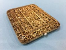 A gilt metal filigree cigarette case
