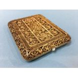 A gilt metal filigree cigarette case