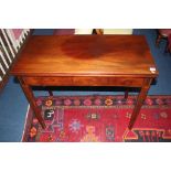 A 19th century mahogany fold over tea table