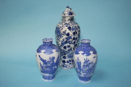 A pair of Chinese blue and white vases, decorated with figures, 17.5cm height and a tall blue and