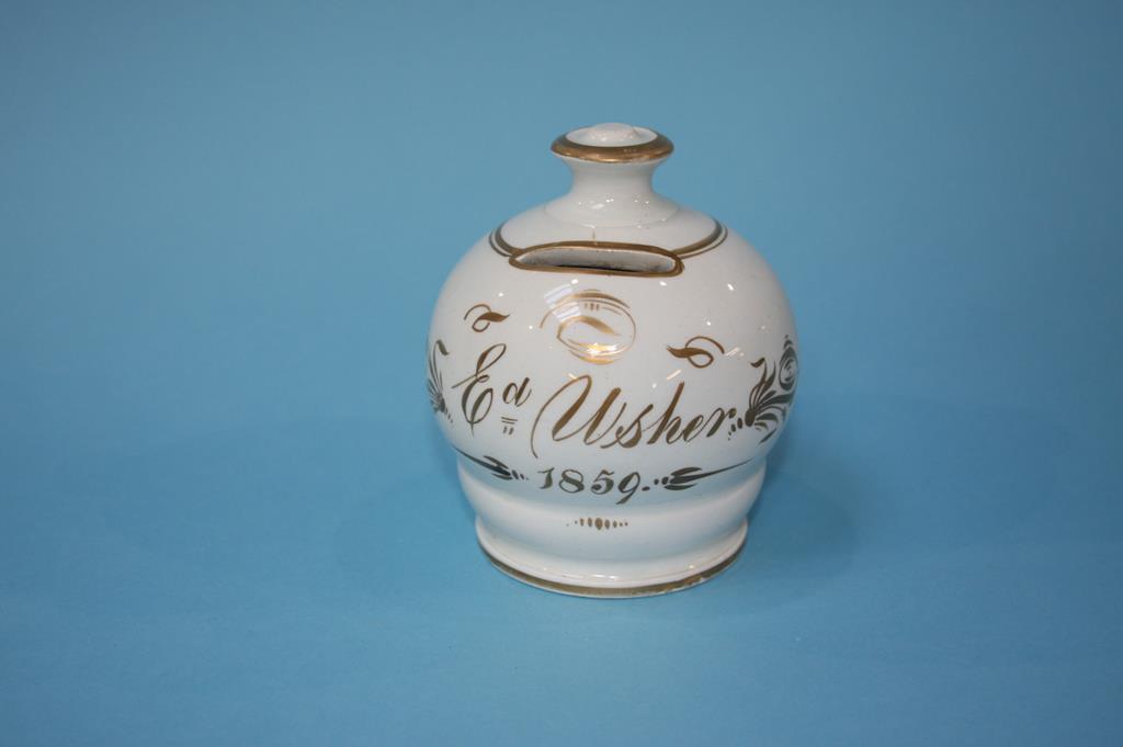 A small Victorian pottery money box, Ed Usher, dated 1859. 10cm height