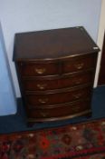 Walnut bowfront chest of drawers