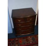 Walnut bowfront chest of drawers