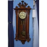 A double weight walnut cased Vienna wall clock