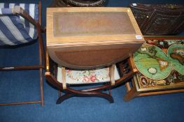 An 'X' frame stool and drop leaf table