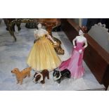 Three Beswick dogs and two figures