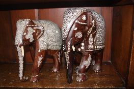 Two carved wood and inlaid elephants