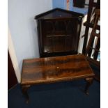 A coffee table and corner cabinet