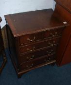 A small reproduction mahogany chest of drawers