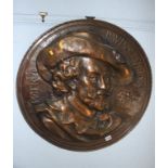 A large metalwork relief plaque, 68cm diameter