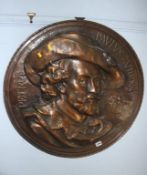 A large metalwork relief plaque, 68cm diameter