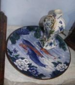 A Continental earthenware faience vase and Japanese Imari wall plate