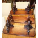 Three mahogany wall shelves