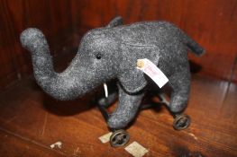 A Steiff elephant on wheels