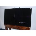 A Sony 55" flat screen, wall mounted TV