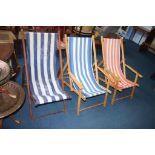 Three traditional folding deck chairs