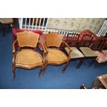 A pair of bergère open armchairs and a pair of chairs