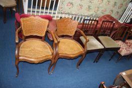 A pair of bergère open armchairs and a pair of chairs